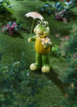Schildkröte mit Solar-Blume und Regenschirm