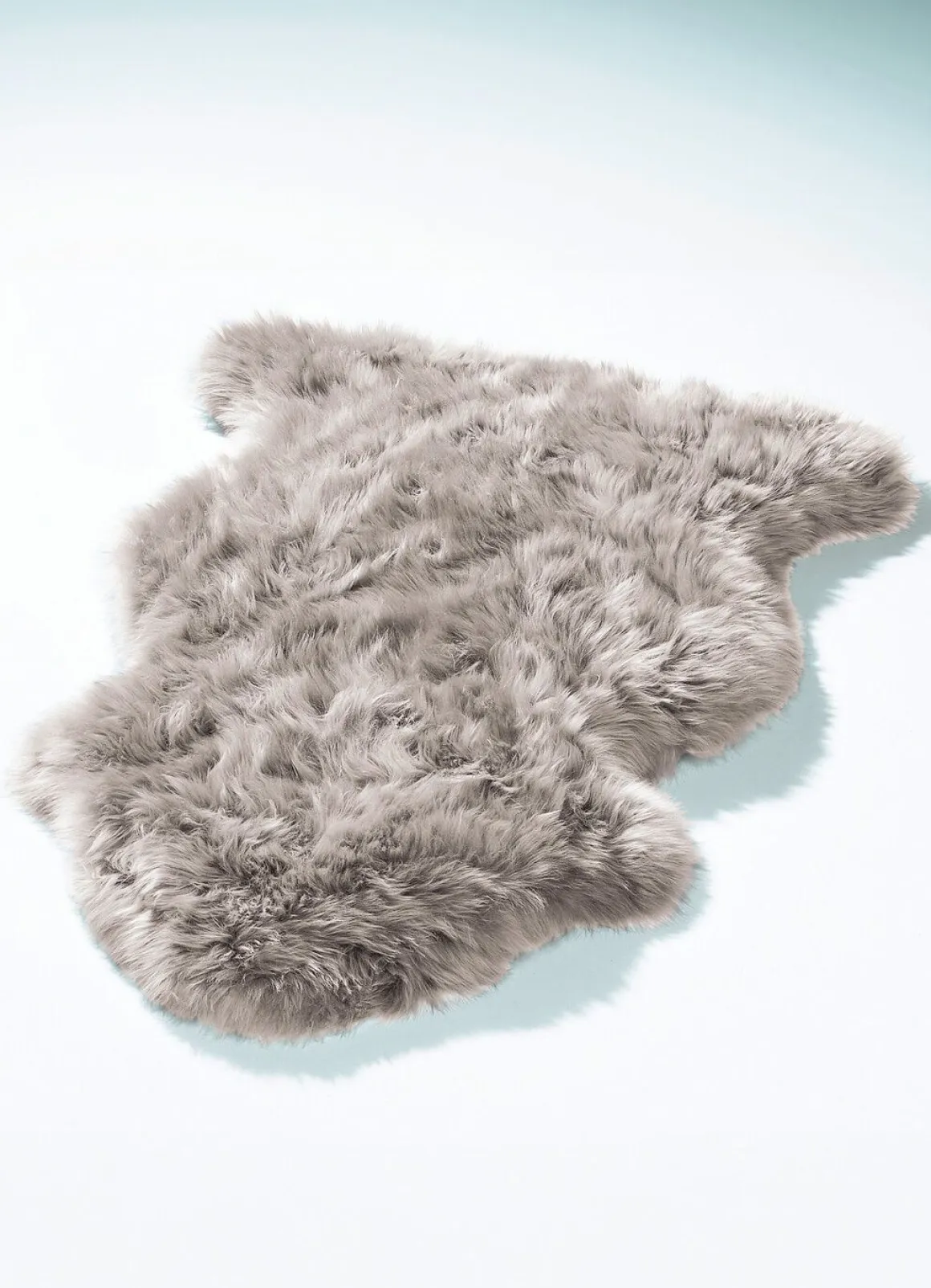 Vorleger aus echtem Lammfell in Tierform